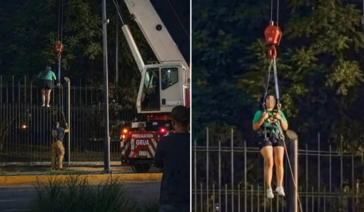 离谱又无奈！女球迷爬墙参加世界杯活动被困，起重机到场营救